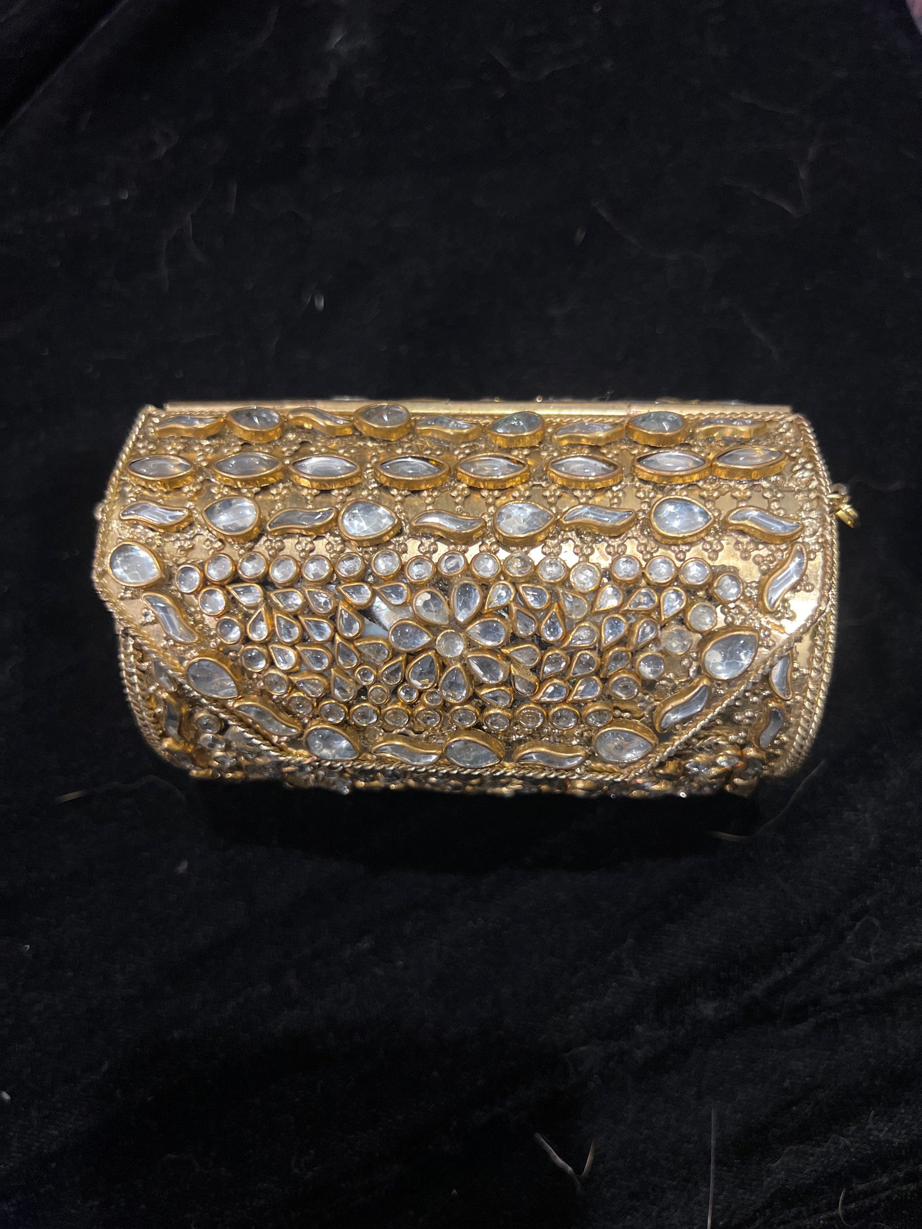 Small gold Kundan clutch